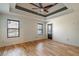 Spacious main bedroom with hardwood floors and ceiling fan at 7042 Confederate Ct, Villa Rica, GA 30116