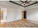 Large main bedroom with hardwood floors and tray ceiling at 7042 Confederate Ct, Villa Rica, GA 30116