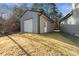 Detached storage building with metal siding and roll-up door at 7042 Confederate Ct, Villa Rica, GA 30116