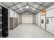 Spacious workshop with metal walls and roll-up door at 7042 Confederate Ct, Villa Rica, GA 30116