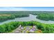 Aerial view of a home near a lake, illustrating its desirable location amidst lush greenery at 413 Solace Pl, Canton, GA 30114