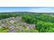 Overhead view of a suburban community surrounded by dense green forest at 413 Solace Pl, Canton, GA 30114