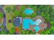 An aerial shot of the neighborhood pool and clubhouse surrounded by manicured landscaping at 413 Solace Pl, Canton, GA 30114
