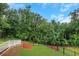 Backyard is spacious with wooden fence and lots of trees at 413 Solace Pl, Canton, GA 30114