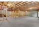 Unfinished basement with exposed ceiling and framing allows for customization and future expansion at 413 Solace Pl, Canton, GA 30114
