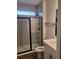 Modern bathroom featuring a glass-enclosed shower and sleek vanity at 413 Solace Pl, Canton, GA 30114