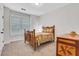 Cozy bedroom featuring a classic wooden bed frame and ample natural light at 413 Solace Pl, Canton, GA 30114