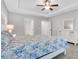 Bright bedroom with tray ceilings features a comfortable bed, plush carpet, and double windows at 413 Solace Pl, Canton, GA 30114