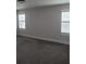 Spacious bedroom with neutral-colored carpeting and window shutters at 413 Solace Pl, Canton, GA 30114