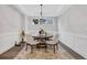 Bright dining area featuring modern lighting and a stylish area rug over hardwood floors at 413 Solace Pl, Canton, GA 30114