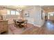 Bright dining room featuring natural light, a stylish chandelier, and hardwood flooring at 413 Solace Pl, Canton, GA 30114
