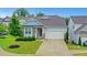 Charming single-Gathering home with stone accents, well-manicured lawn, and a two-car garage at 413 Solace Pl, Canton, GA 30114