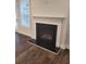 Gas fireplace with a modern mantel and dark hearth, adding warmth and style at 413 Solace Pl, Canton, GA 30114