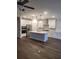 Modern kitchen with white cabinets and center island at 413 Solace Pl, Canton, GA 30114