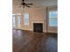 Spacious living room with fireplace and hardwood floors at 413 Solace Pl, Canton, GA 30114