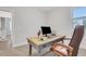Well-lit home office featuring a functional desk and comfortable leather chair at 413 Solace Pl, Canton, GA 30114