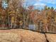 Private wooded lot with mature trees and lake views at 413 Solace Pl, Canton, GA 30114