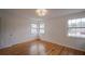 Hardwood floor bedroom with two windows and ceiling light at 1098 Jefferson Ave, Atlanta, GA 30344