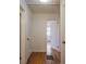 Bright hallway with hardwood floors and access to bedrooms at 1098 Jefferson Ave, Atlanta, GA 30344