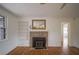 Living room with wood floors, stone fireplace, and built-in shelving at 1098 Jefferson Ave, Atlanta, GA 30344