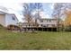 Expansive deck with fire pit overlooking a wooded area at 5322 Seaton Dr, Dunwoody, GA 30338