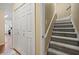 Upper level hallway with staircase and built-in storage at 1809 Francon Sw Ct, Conyers, GA 30094