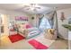 Spacious bedroom with cozy sitting area and large window at 2354 Attewood Dr, Buford, GA 30519