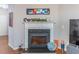 Modern fireplace with a white mantel and decorative accessories at 2354 Attewood Dr, Buford, GA 30519