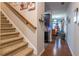 Carpeted staircase with wooden railing leading to the upper level at 2354 Attewood Dr, Buford, GA 30519