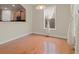 Bright dining room with hardwood floors, natural light and adjacent access to the kitchen at 5480 Beaver Ridge Dr, Cumming, GA 30040