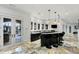 Basement bar with curved counter and French doors to backyard at 1055 Leadenhall St, Alpharetta, GA 30022
