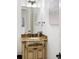 Vanity with granite countertop in an elegant powder room at 1055 Leadenhall St, Alpharetta, GA 30022