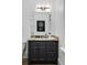Modern bathroom with granite vanity and dark cabinetry at 1055 Leadenhall St, Alpharetta, GA 30022