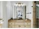 Bathroom with a large vanity, mirror, and walk-in shower at 1055 Leadenhall St, Alpharetta, GA 30022