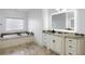 Elegant bathroom with granite vanity, soaking tub, and modern lighting at 1055 Leadenhall St, Alpharetta, GA 30022