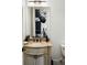 Light beige bathroom with granite vanity and decorative detailing at 1055 Leadenhall St, Alpharetta, GA 30022
