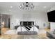Spacious main bedroom with large bed, chandelier, and stunning views at 1055 Leadenhall St, Alpharetta, GA 30022