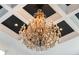 Grand, ornate chandelier with crystal accents at 1055 Leadenhall St, Alpharetta, GA 30022