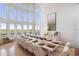 Elegant dining room with large windows, a long table, and white chairs at 1055 Leadenhall St, Alpharetta, GA 30022
