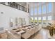Spacious dining room with a long table, white chairs, and expansive windows at 1055 Leadenhall St, Alpharetta, GA 30022