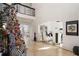 Elegant two-story entryway with marble floors, a grand staircase, and a decorated Christmas tree at 1055 Leadenhall St, Alpharetta, GA 30022