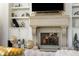 Elegant fireplace with stone mantel and built-in shelving at 1055 Leadenhall St, Alpharetta, GA 30022