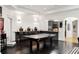 Basement game room features ping pong table, bar, and kitchen at 1055 Leadenhall St, Alpharetta, GA 30022