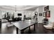 Game room with ping pong table, seating area, and dark hardwood floors at 1055 Leadenhall St, Alpharetta, GA 30022