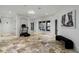Basement home gym with hardwood floors and large windows at 1055 Leadenhall St, Alpharetta, GA 30022