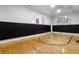 Indoor basketball court with hardwood floors and padded walls at 1055 Leadenhall St, Alpharetta, GA 30022