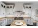 Gourmet kitchen boasts granite countertops, custom cabinetry, and high-end appliances at 1055 Leadenhall St, Alpharetta, GA 30022