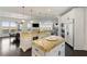 Open concept kitchen with island, breakfast area, and views at 1055 Leadenhall St, Alpharetta, GA 30022