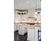 Elegant kitchen with white cabinets, granite counters, and island at 1055 Leadenhall St, Alpharetta, GA 30022