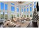 Living Room with large windows, fireplace, and sectional sofa at 1055 Leadenhall St, Alpharetta, GA 30022